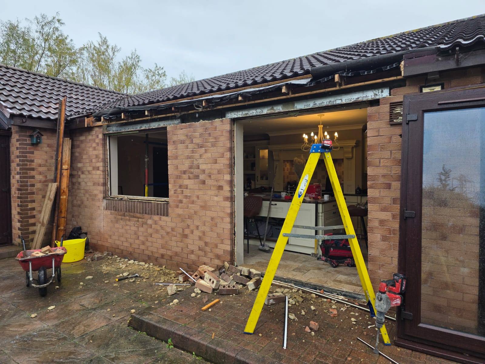 Rear elevation during demolition of the original window opening